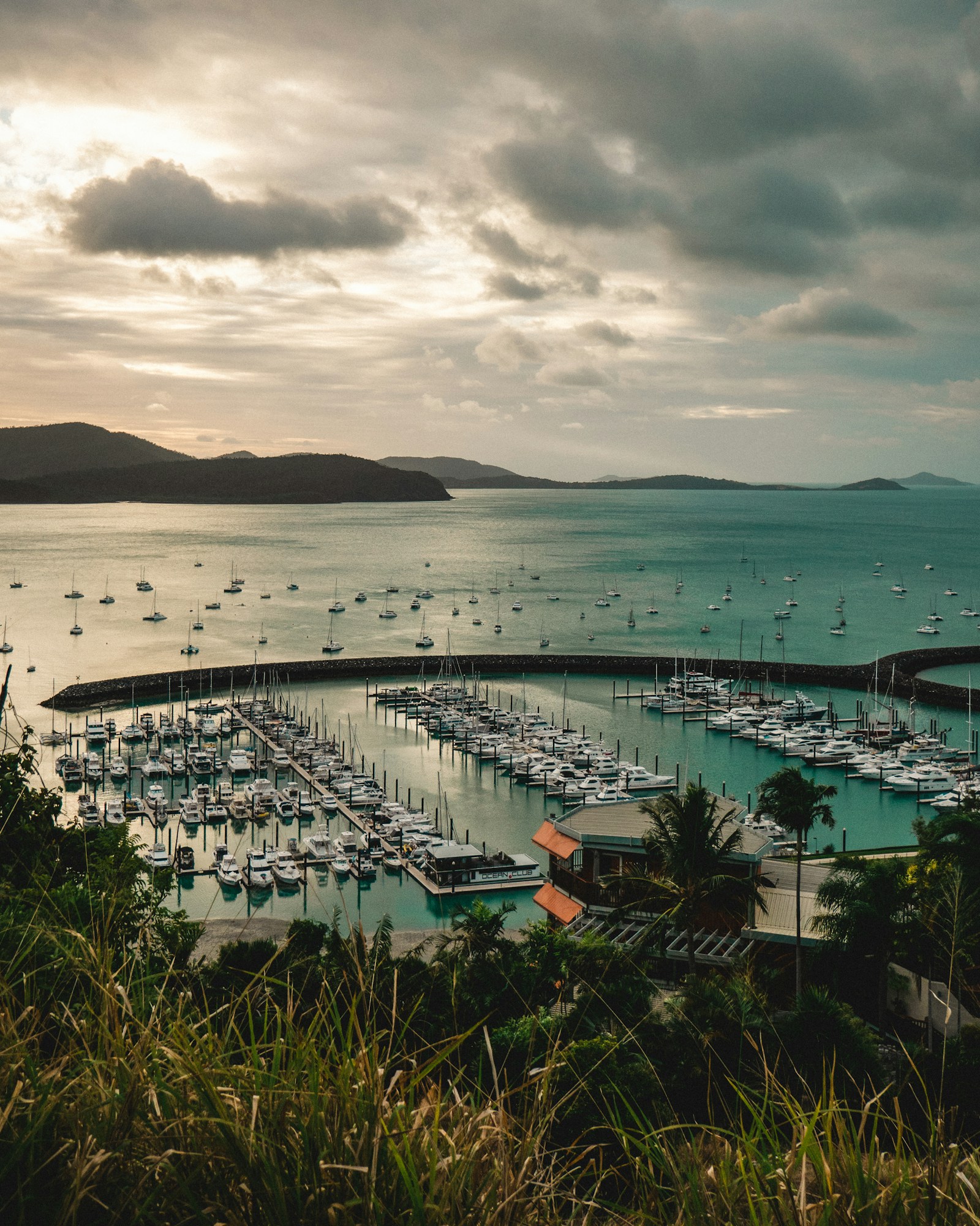 Yachts in Airlie Beach harbour, Queensland, under an evening sky